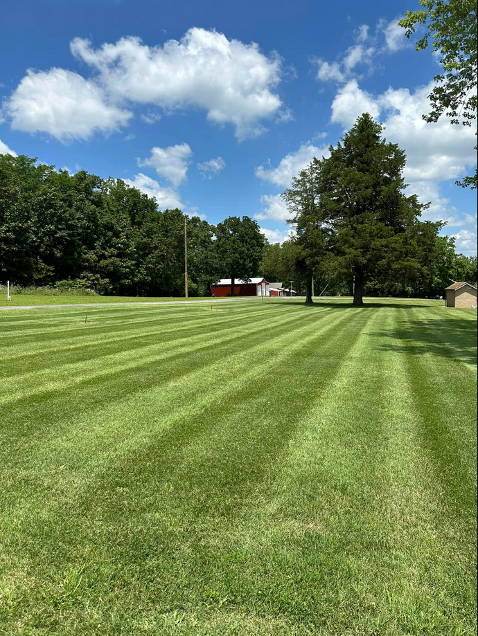 Large open field maintained by CJM Landscaping in Springfield, MO area.